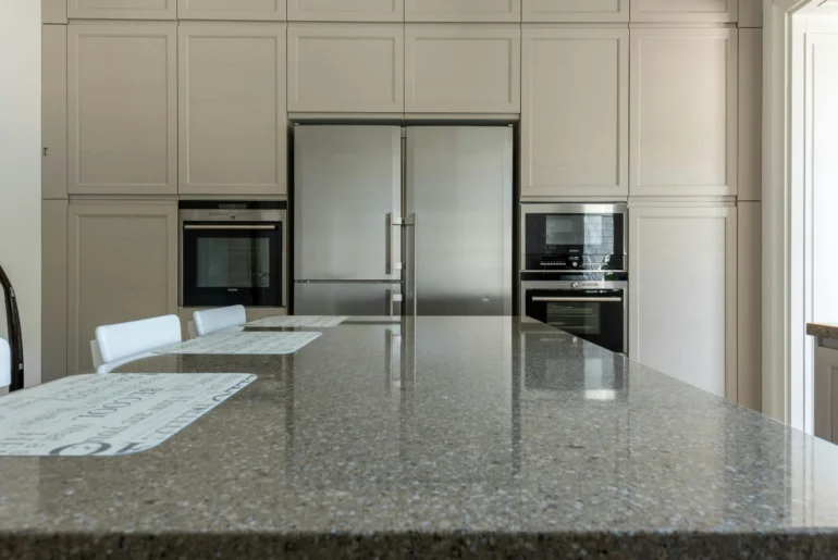 Beige Kitchen Cabinets And Green Granite Countertops